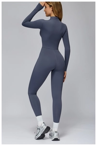 Detailed back view of ergonomic stitching on a blue thermal yoga jumpsuit