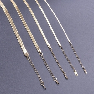 Detail showing five different widths of 18k gold plated stainless steel snake chains