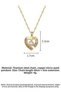 Detail view of gold heart pearl pendant necklace with size dimensions and measurements