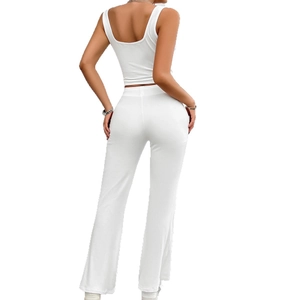 White sleeveless crop top and high-waisted flared yoga pants two-piece set for women
