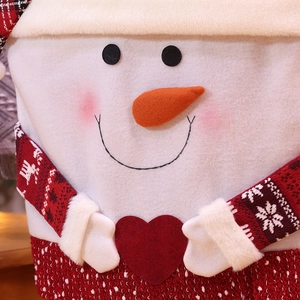 Christmas snowman chair cover with red knit sleeves and snowflake patterns for home decor