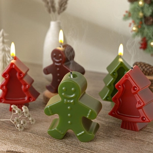 Gingerbread man and Christmas tree scented candles with detailed embossed festive textures