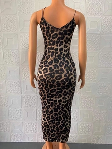 Detail of the leopard print bodycon maxi dress showing the thin straps and back silhouette