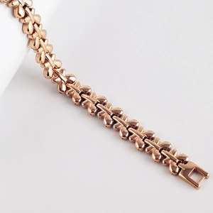 Detail of rose gold bracelet featuring butterfly-shaped links and a secure square clasp