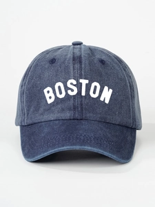 Detailed close-up of dark blue washed denim baseball cap featuring white BOSTON print