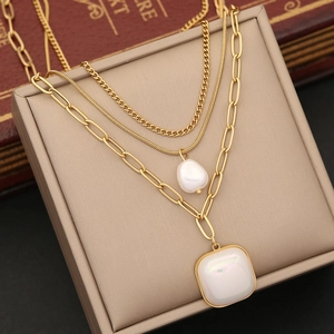 Multi-layer gold necklace with baroque pearl and square iridescent heart pendant