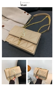 Detail of khaki PU chain bag with geometric quilted texture and gold tassel charm