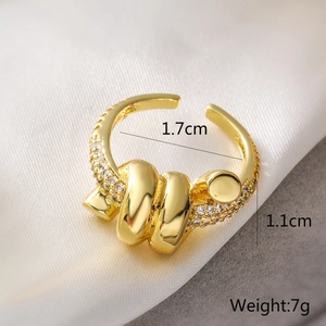 Detail view of irregular gold ring with cubic zirconia inlay and precise measurements