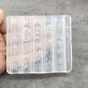 Detailed view of sea-themed silicone nail art mold featuring starfish and shells