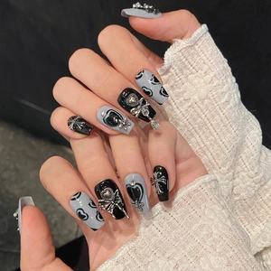 Y2K style handmade coffin press-on nails with silver heart and gothic cross charms