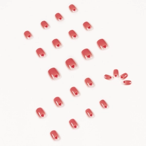 Set of 24 gradient red press-on nails with heart designs and shiny finish on white background
