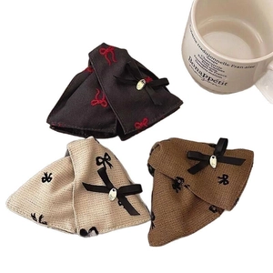 Elegant fabric bow hair claw clips in black, beige and brown with metal accents