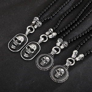 Gothic skull pendant necklace with black agate beads and silver-toned metal charms