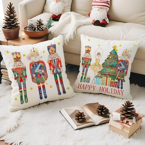 Detailed view of watercolor Nutcracker and mouse king prints on linen Christmas pillows