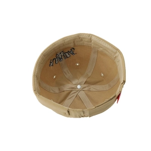 Inside view of khaki cotton docker hat for kids featuring reinforced seams and adjustable strap