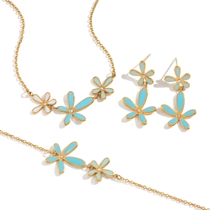 Gold-plated daisy jewelry set with light blue enamel flowers and crystal accents