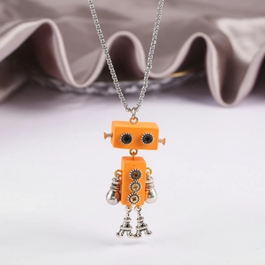 Detail of mechanical robot necklace with orange gears and Eiffel Tower legs