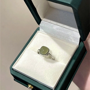 Vintage silver open ring with sugar-cube white jade in a luxury dark green jewelry gift box