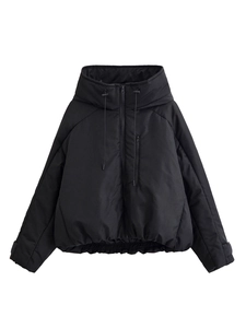Close-up of black hooded puffer jacket with zipper closure and elastic hem detail