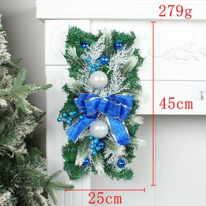 Detailed view of Christmas wreath with blue bow, silver ornaments, 45x25cm dimensions