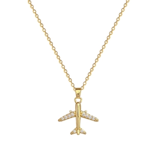 Elegant gold titanium steel airplane necklace with sparkling crystal wings on white base