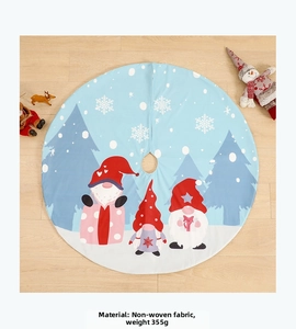 Detail of blue non-woven Christmas tree skirt with gnome print and snowflake patterns