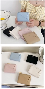 Close-up of minimalist PU leather wallets in various colors with Classic Star logo