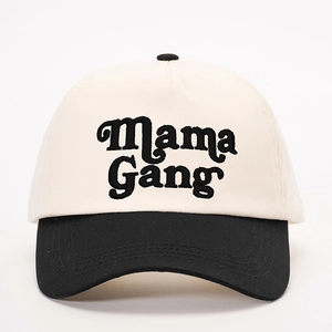 Close-up of Mama Gang embroidery on the beige and black two-tone baseball cap