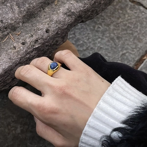 Retro gold lapis lazuli open ring for women shown on a model in a natural setting