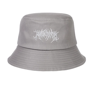 Close-up of gothic white thorn embroidery on a gray washed cotton bucket hat
