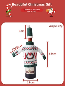 Detailed view of festive snowman knit wine bottle sweater with JOY pattern and mini hat