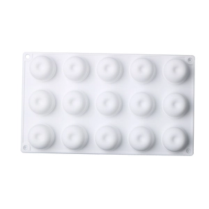 Detail of 15-cavity white silicone mold for making round chocolates and desserts