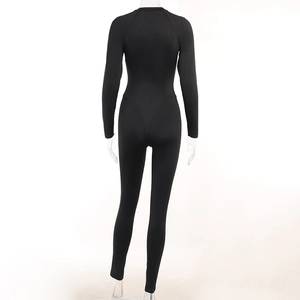 Rear view of black long sleeve bodysuit with slimming fit and athletic seam details