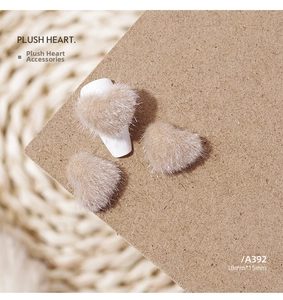 Detail of 18x15mm plush heart charms in tan color for nail art and DIY crafts
