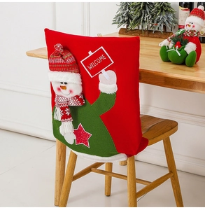 Detail of Santa and Snowman chair covers for festive dining room holiday decoration