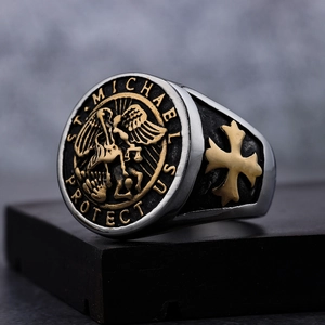 Vintage St. Michael Archangel two-tone stainless steel ring for men on stone base