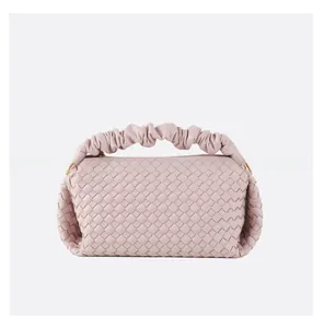 Detailed view of lavender woven leather texture and soft ruffled cloud handle detail