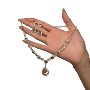 Luxurious vintage jewelry set with champagne flower rhinestones on necklace and earrings