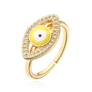 Detail of gold evil eye open ring featuring colorful zircon stones and drip oil texture