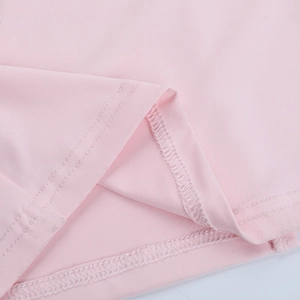 Detail of pink knitted dress hemline featuring professional double-needle stitching