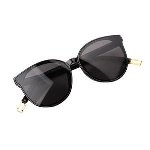 Fashionable black and gold cat-eye sunglasses for kids with stylish light blue lenses
