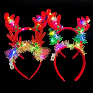 LED Christmas headband set with glowing reindeer antlers and sequin trees on black background