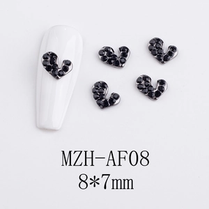 Close-up of heart-shaped dark rhinestones for nail art, 8x7mm metal alloy decorations
