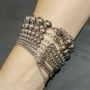 Polished stainless steel beaded chain bracelet stack with silver spherical metal beads