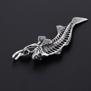 Detailed view of silver titanium steel fishbone pendant with intricate metal textures
