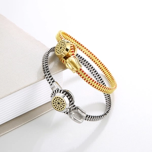 Detail of titanium steel zipper bracelet with woven rope in gold-red and silver-black