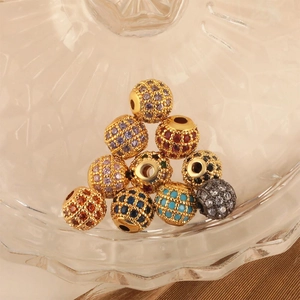 Macro shot of colorful cubic zirconia beads in gold setting for DIY jewelry making