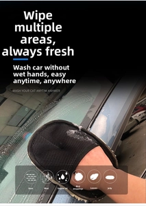Detail of black mesh car wash glove wiping glass surface with rich foaming effect