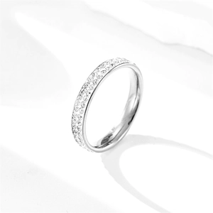 Detail shot of a titanium steel ring featuring double-row sparkling pavé crystals
