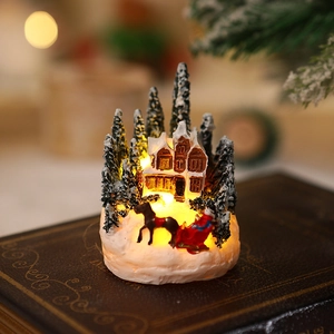 Macro detail of glowing resin Christmas village house with warm LED light on vintage book